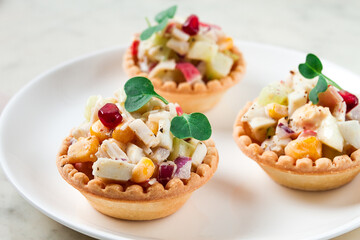 canapes with salad, corn with crab sticks, appetizer, portioned, close-up, no people,