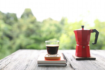 Coffee glass cup and notebook with red moka pot