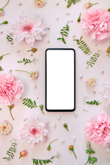 Phone mock up screen on pink pastel flowers white floral feminine spring background. Mockup...