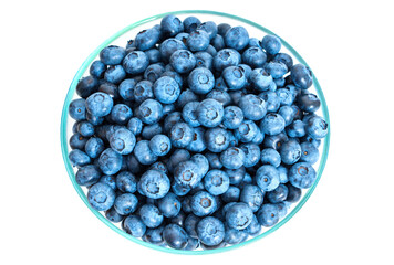 Blueberries in a glass bowl on white