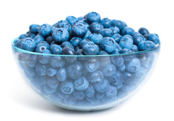 Bowl of fresh blueberries on white