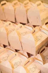 Rows of cardboard boxes with gifts at a wedding party