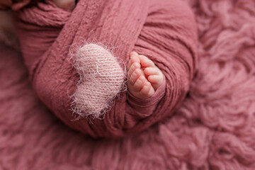 The tiny foot of a newborn baby