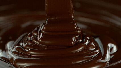 Pouring Dark Hot Melted Chocolate, Close-up.
