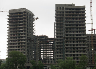 Fototapeta premium Unfinished development of city buildings