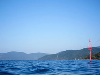 Blue sea with ripples, and mountains at Angra dos Reis town, State of Rio de Janeiro, Brazil. Taken...
