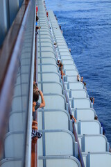 People taking pictures from a cruise ship