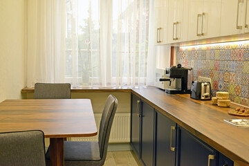 Dining table and appliances in the kitchen
