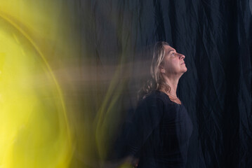 Time lapse view of woman moving a rag. Long exposure, motion blur.