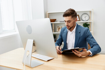 businessmen computer desktop work self-confidence paper folder Gray background