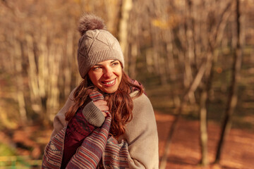 Woman relaxing in nature on sunny autumn day
