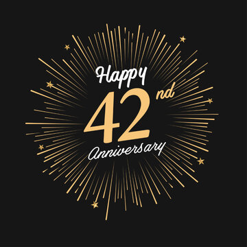 Happy 42nd Anniversary with fireworks and star on dark background.