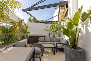 Hotel resort apartment terraces with armchairs and table