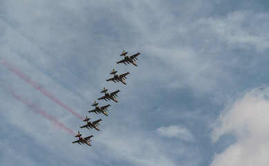 Russian Air Force planes paint the colors of the Russian flag in the sky on St. Petersburg during the celebration of the Day of the Navy