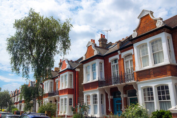 Fototapeta na wymiar UK- street of upmarket terraced brick houses in suburban west London