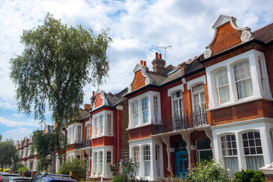 UK- street of upmarket terraced brick houses in suburban west London