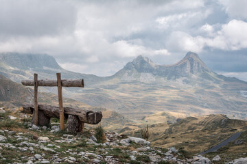 Empty bench watching over a mountain range in Durmitor national park, Montenegro