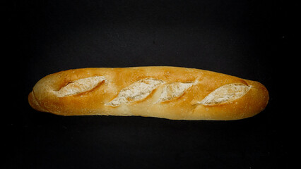 Fresh bread baguette loaf with seeds in a rustic style. Baking homemade healthy bread