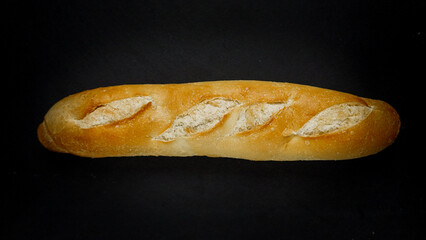 Fresh bread baguette loaf with seeds in a rustic style. Baking homemade healthy bread