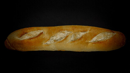 Fresh bread baguette loaf with seeds in a rustic style. Baking homemade healthy bread