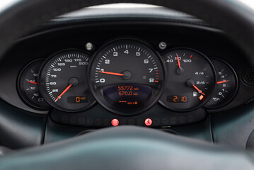 car dashboard with speedometer close up