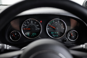 Dashboard of a Car with Speedometer and Tachometer