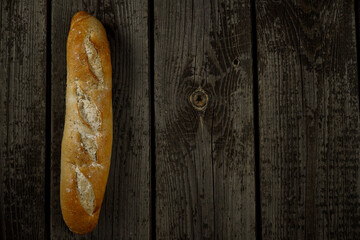 Fresh bread baguette loaf with seeds in a rustic style. Baking homemade healthy bread
