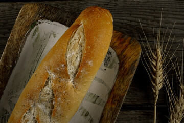 Fresh bread baguette loaf with seeds in a rustic style. Baking homemade healthy bread