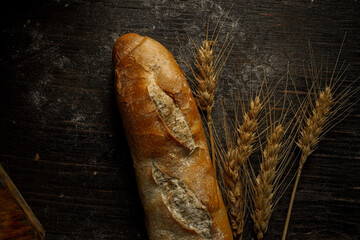 Fresh bread baguette loaf with seeds in a rustic style. Baking homemade healthy bread