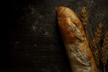 Fresh bread baguette loaf with seeds in a rustic style. Baking homemade healthy bread