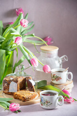 Still life, concept of early spring breakfast with coffee or tea and cupcake
