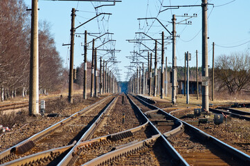 Fototapeta na wymiar electrified railway on a blue sky background