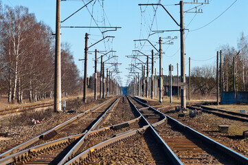 Fototapeta na wymiar electrified railway on a blue sky background