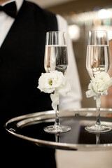 Two wedding champagne glasses on a tray