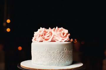 Turquoise wedding cake decorated with flower patterns