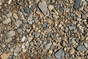 The texture of the surface covered with small rounded stones.