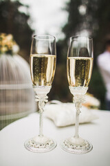 Two wedding champagne glasses on the table
