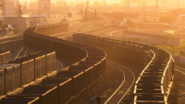 Railway freight transport marshalling yard at sunset