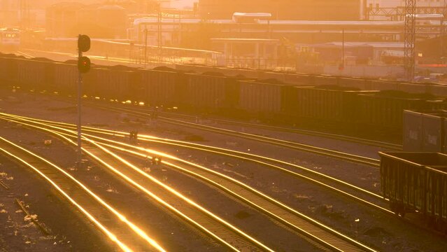 Railway freight transport marshalling yard at sunset