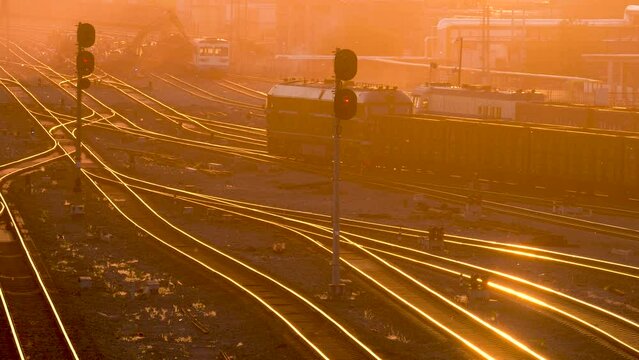 Railway freight transport marshalling yard at sunset