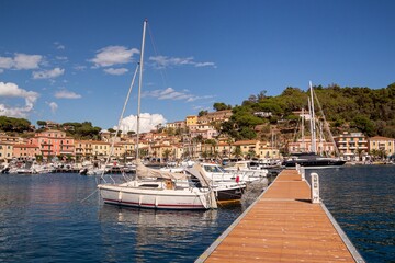 Fototapeta na wymiar Porto Azzurro, Island of Elba, Italy - 19 September 2021 Colorful cityscape of Harbor of Porto Azzurro 