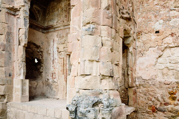 Ruins in rock of the structure of a church, with the detailed artistic engravings of the masonry and masonry in sight, in