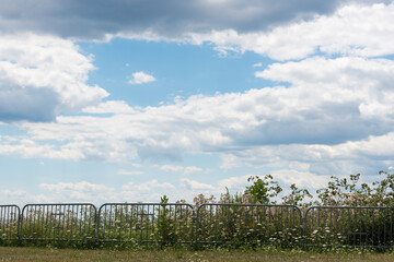 Obraz premium barrier fence at the edge of a cliff by the lake