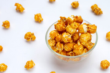 Honey caramel popcorn on white background.