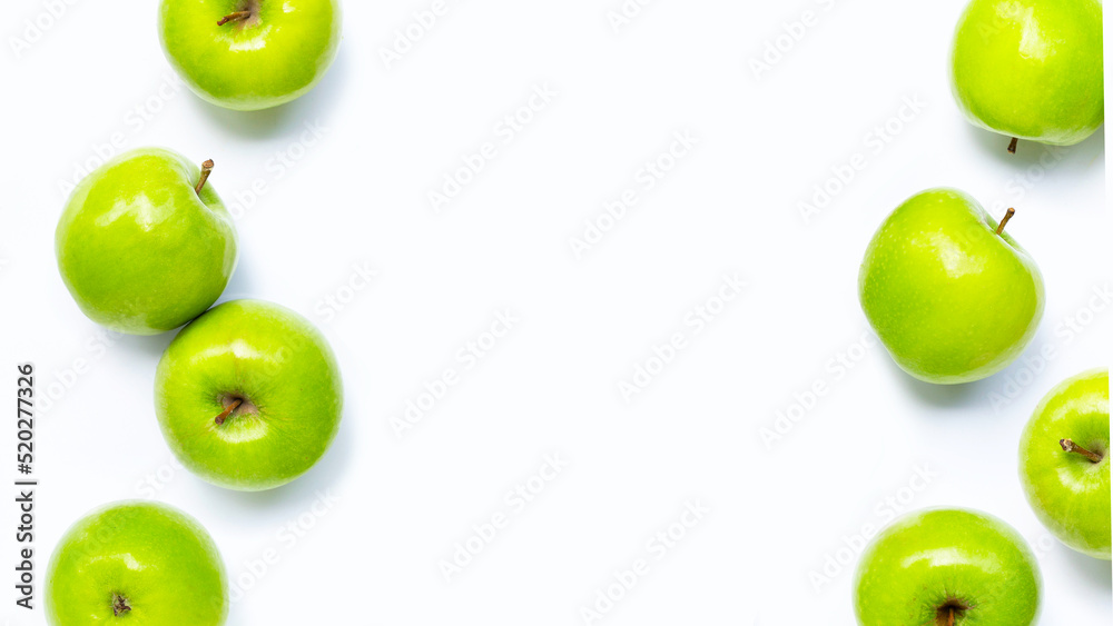 Wall mural frame made of green apples on white background. copy space