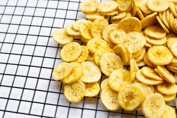 Banana slice chips on white background.