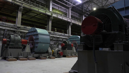 Copper crushing plant. Ball mills in large room of shop at mining enterprise. Crushing equipment at...