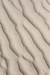 Fototapeta na wymiar Coastal beach sand waves texture background. Sand dunes, tropical seashore landscape.