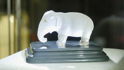 White figurine of an elephant. Statue of the white elephant