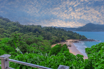 Colourful Skies Sunset over Head Laem Sing Beach in Phuket Thailand. This Lovely island waters are turquoise blue waters, lush green mountains colourful skies and beautiful views of Pa Tong Patong